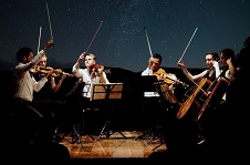 Members of the Rosebud Quartet 
											under the stars